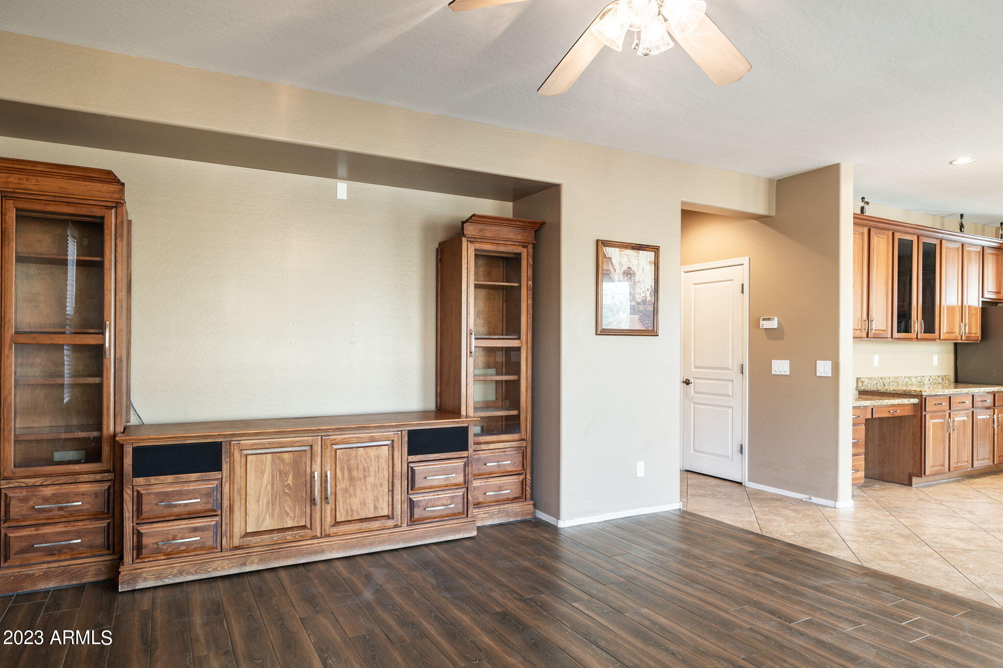 3344 West Montello Road Phoenix, AZ 85086 - Photo 7 of 38 a view of a kitchen with wooden floor and a kitchen