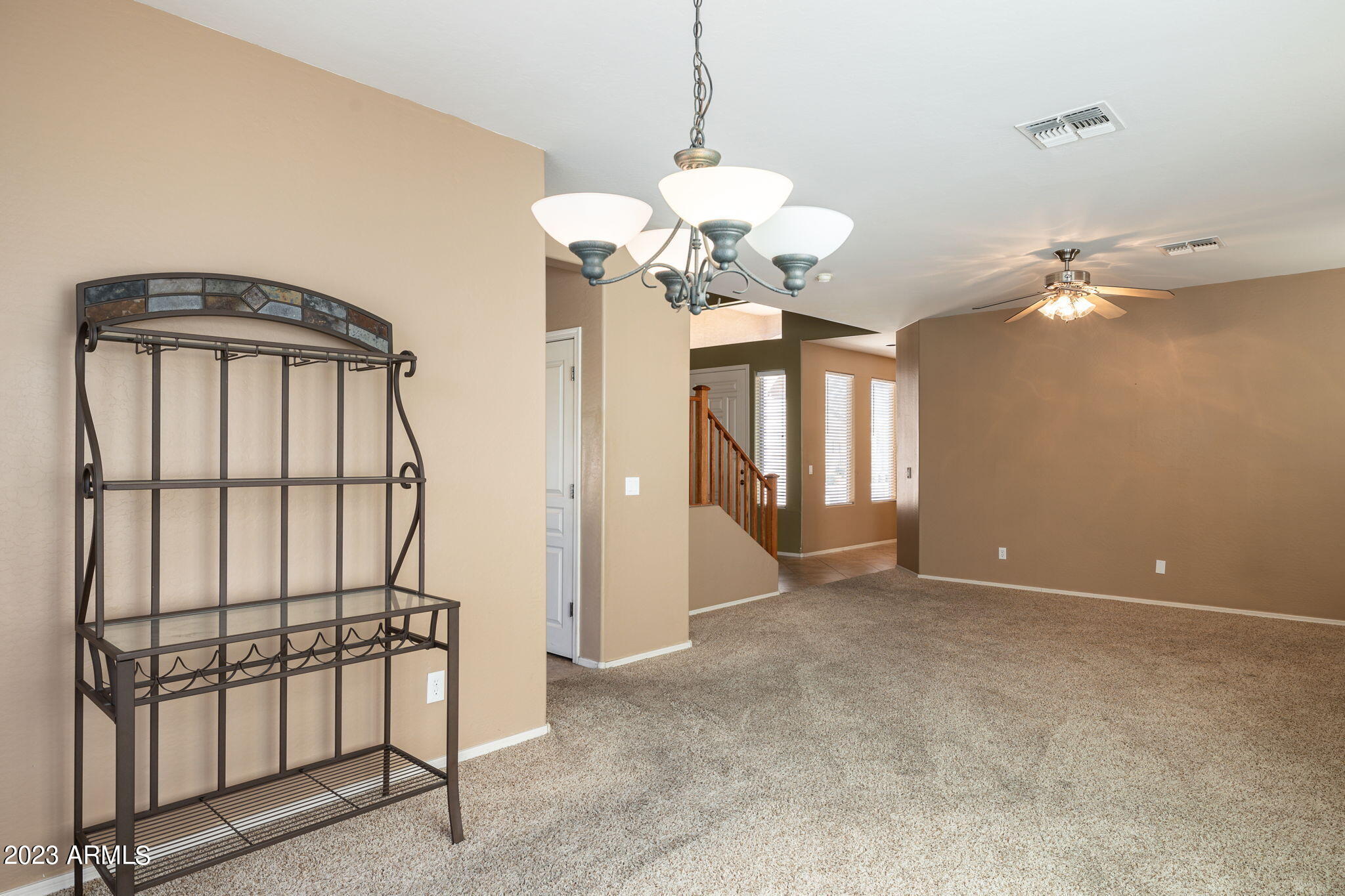 3344 West Montello Road Phoenix, AZ 85086 - Photo 10 of 38 a view of a chandelier and a chandelier in a room
