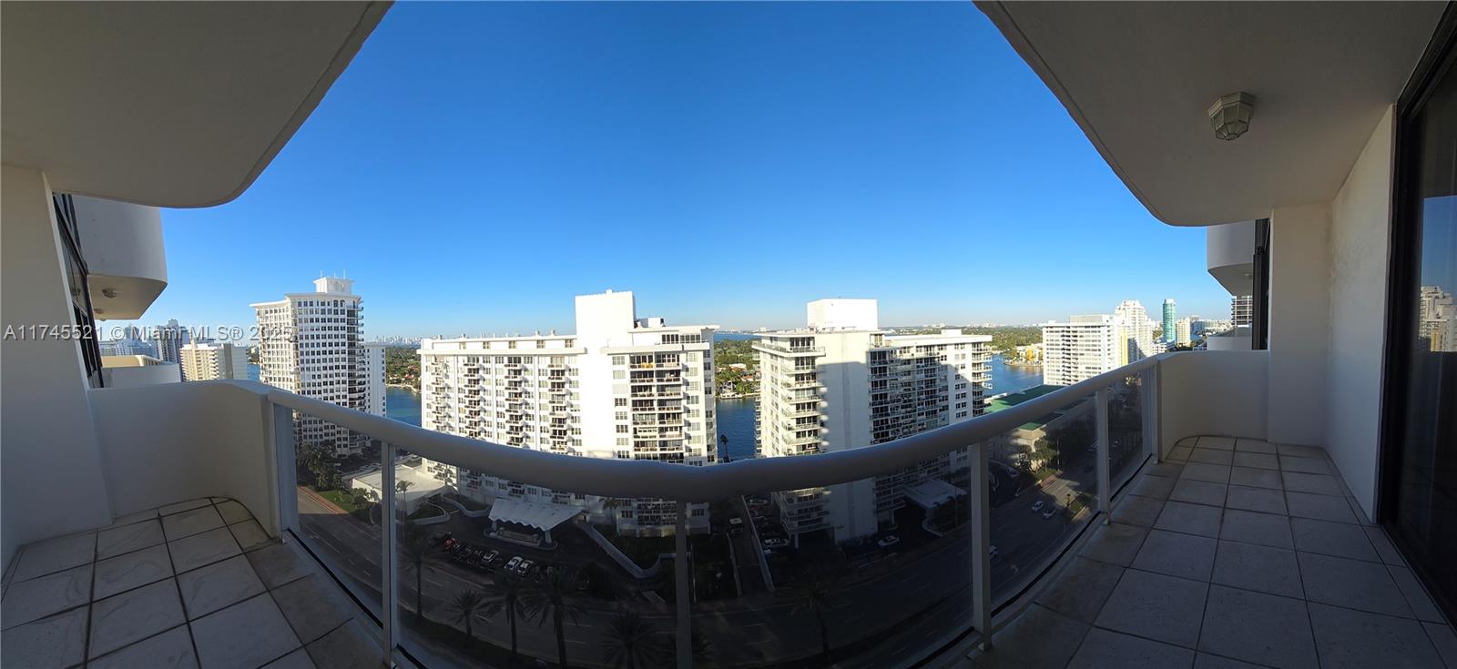 5757 Collins Avenue, Unit 1902 Miami Beach, FL 33140 - Photo 1 of 25 a view of a balcony with city