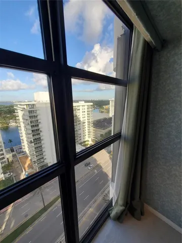 a view of a large window with an outdoor space
