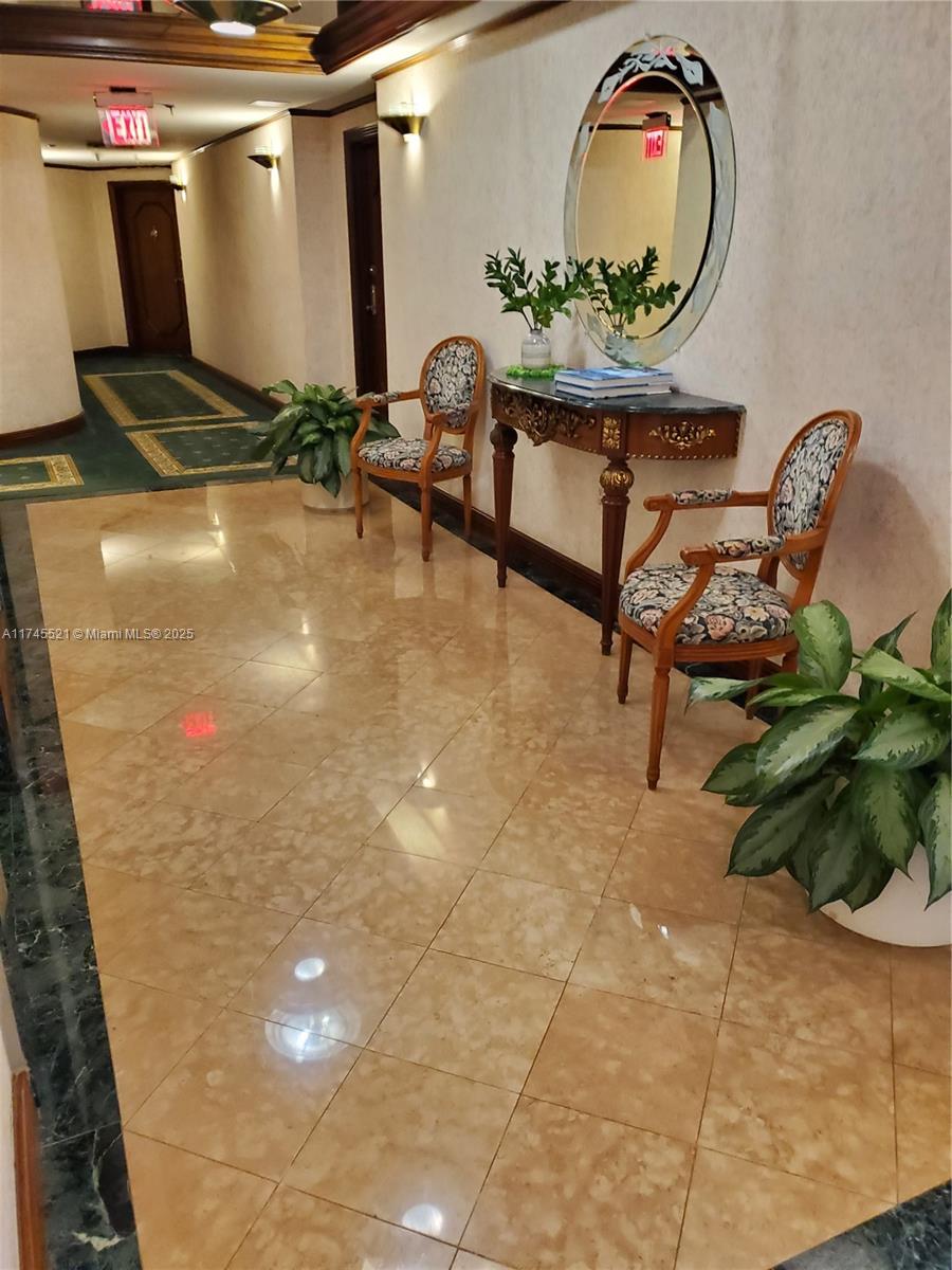 5757 Collins Avenue, Unit 1902 Miami Beach, FL 33140 - Photo 25 of 25 a room with pool table and potted plants