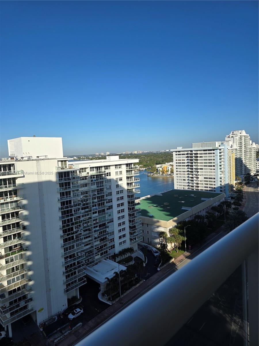 5757 Collins Avenue, Unit 1902 Miami Beach, FL 33140 - Photo 3 of 25 a view of a balcony with city view