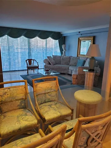 a room with wooden floor and furniture