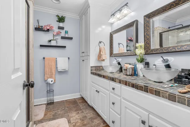 a bathroom with a granite countertop sink a vanity and mirror