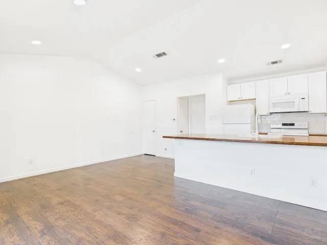 a view of kitchen with wooden floor