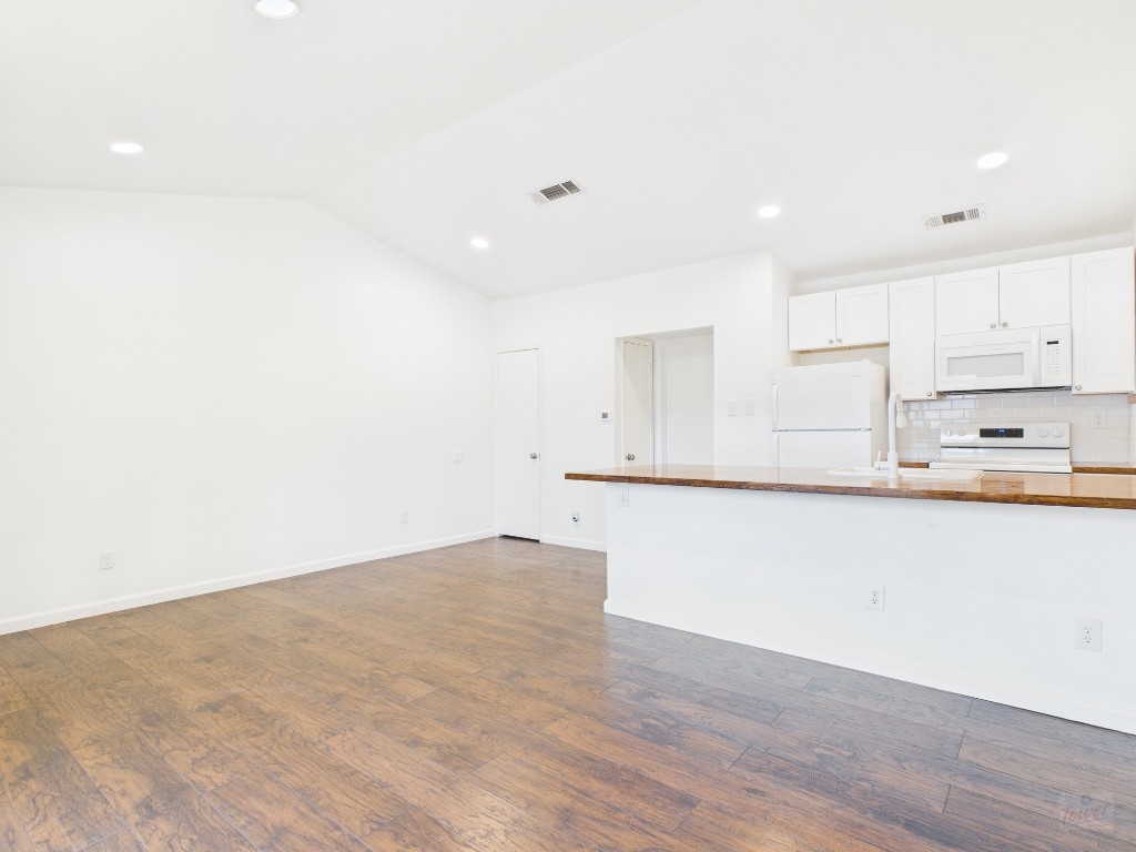 1303 Hollow Creek Drive, Unit 1 Austin, TX 78704 - Photo 2 of 19 a view of kitchen with wooden floor