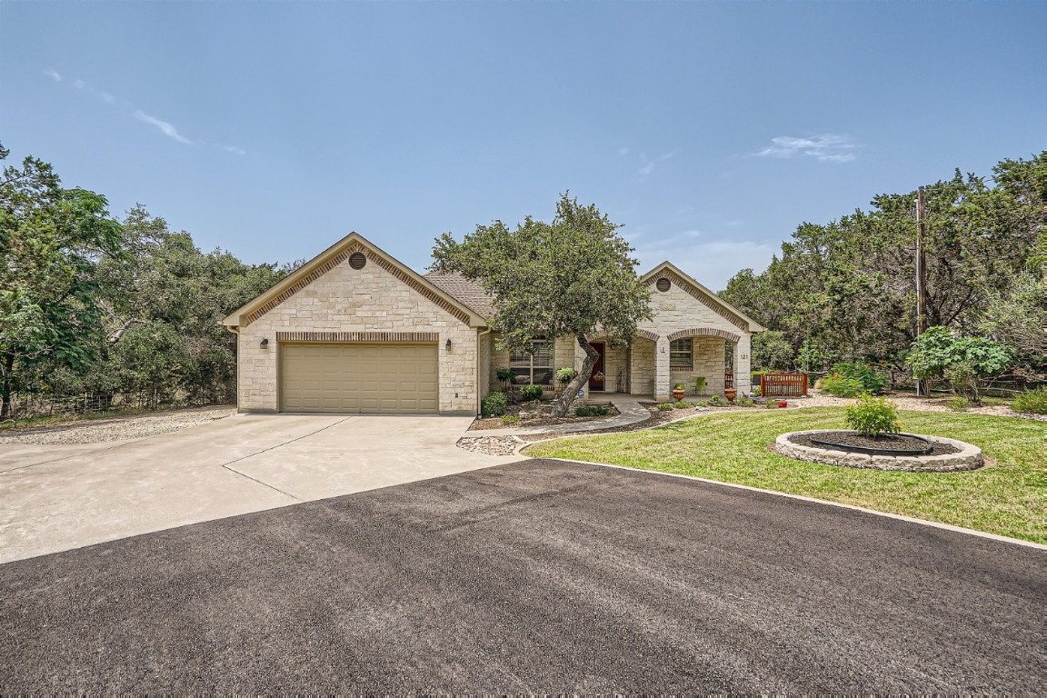 121 Trailridge Road Georgetown, TX 78633 - Photo 1 of 1 a front view of a house with yard and trees