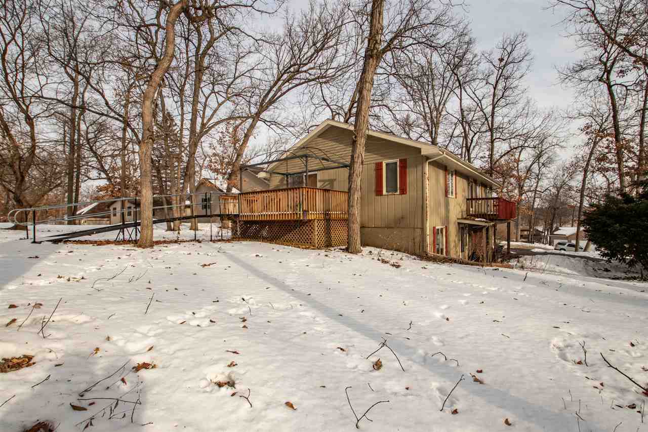 1992 Baintree Road Lake Summerset, IL 61019 - Photo 20 of 20 a front view of a house with a yard covered in snow
