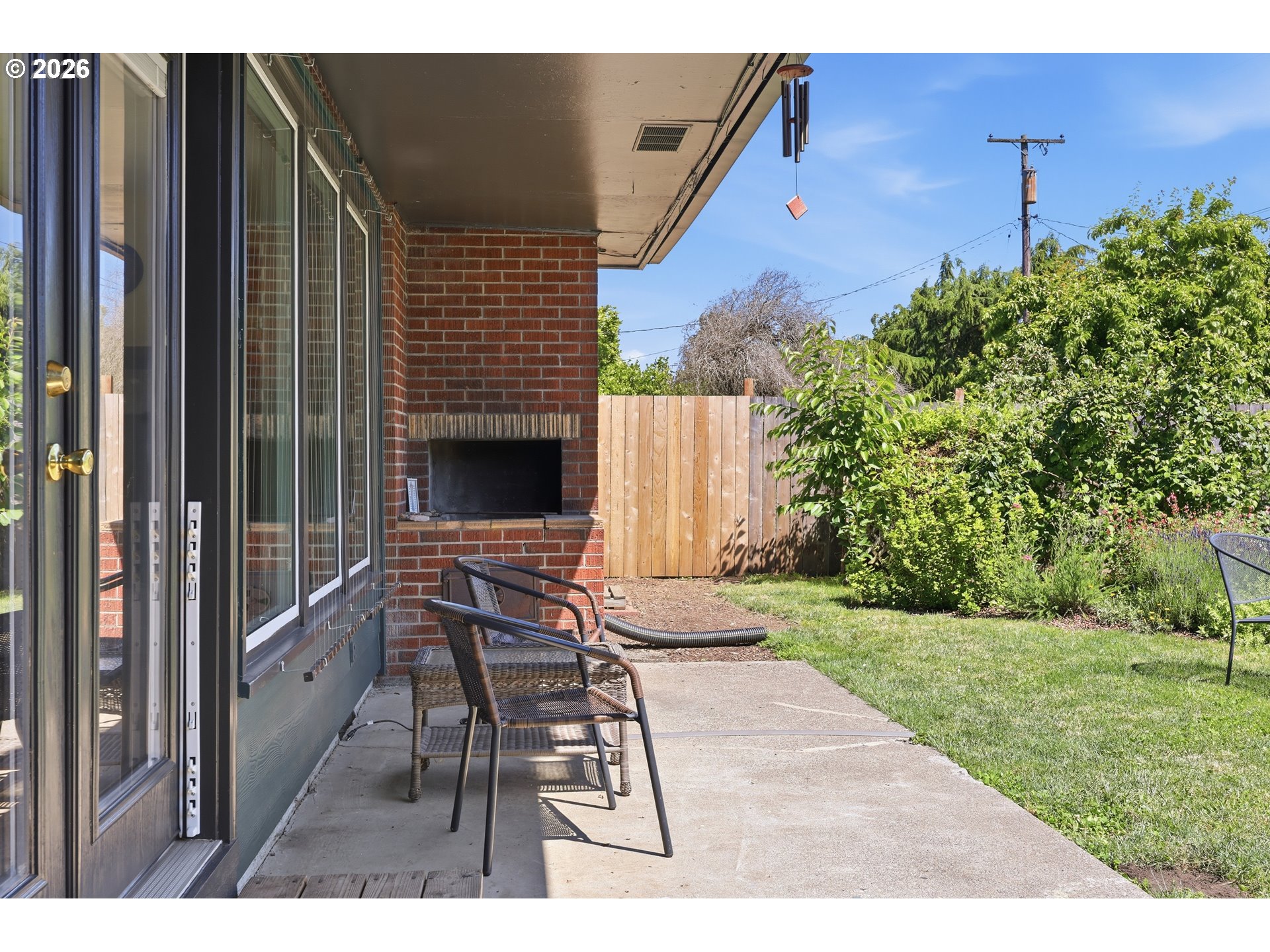 65 Greenvale Drive Springfield, OR 97477 - Photo 31 of 42 a view of a patio with a table and chairs and potted plants