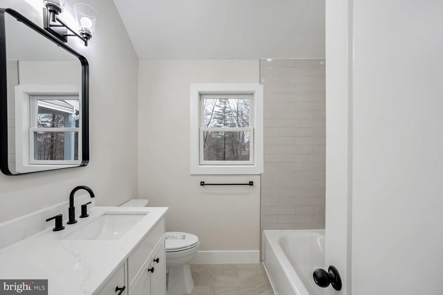 358 A Cherry Valley Road Princeton, NJ 08540 - Photo 15 of 28 a bathroom with a sink a toilet and shower