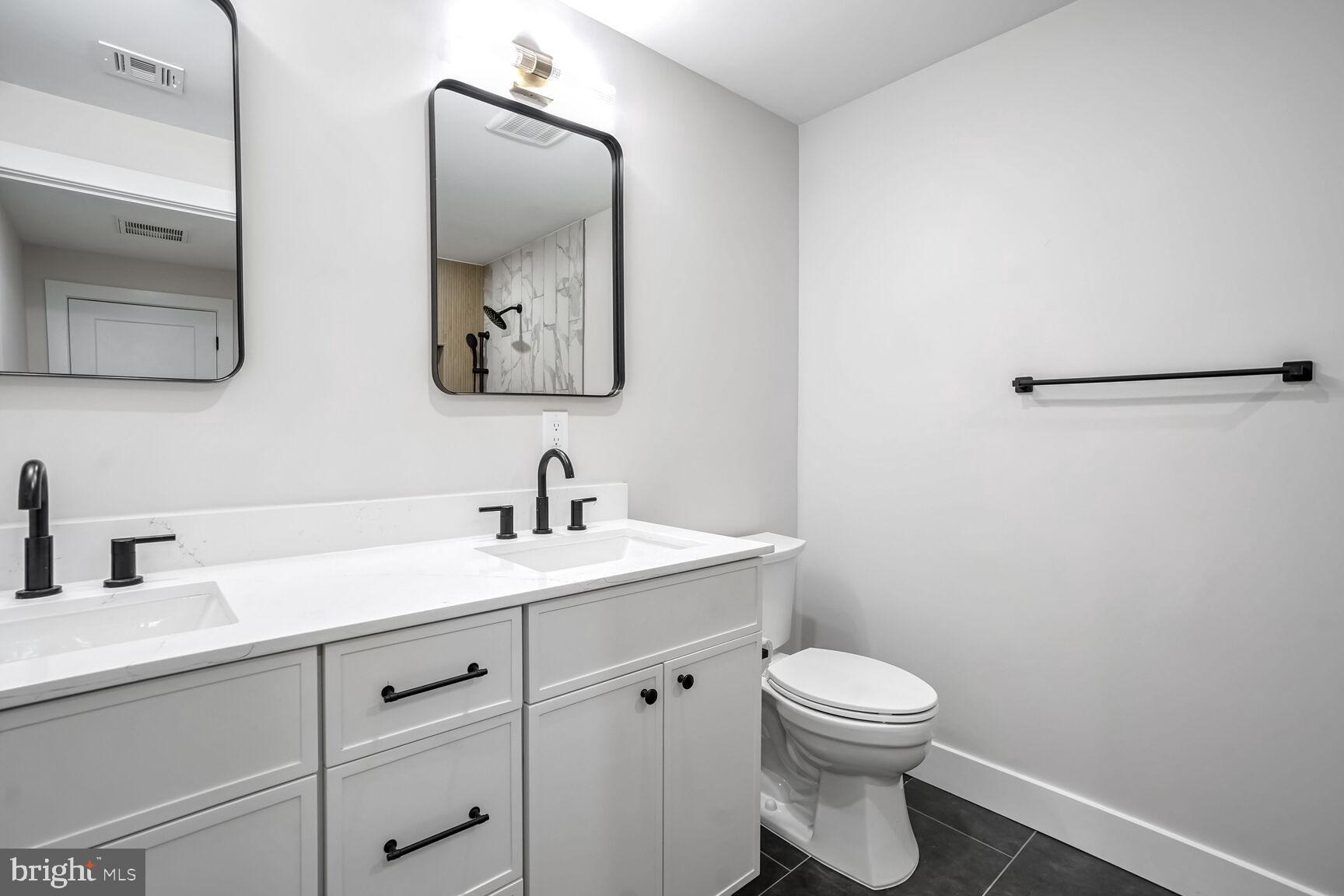 358 A Cherry Valley Road Princeton, NJ 08540 - Photo 18 of 28 a bathroom with a toilet a sink and mirror
