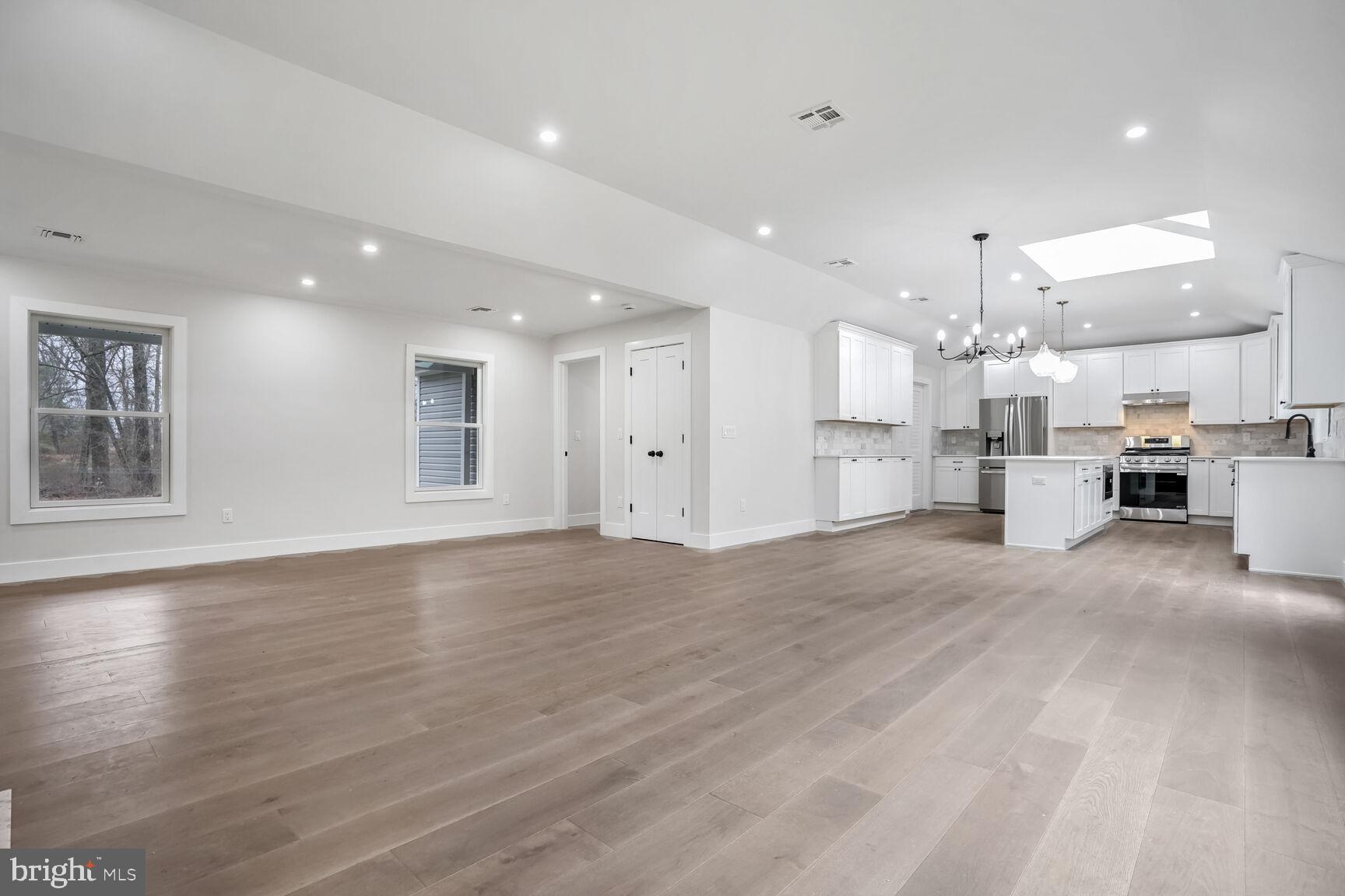 358 A Cherry Valley Road Princeton, NJ 08540 - Photo 5 of 28 a view of kitchen with kitchen island white cabinets and wooden floor
