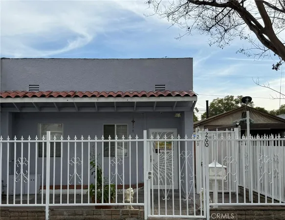 a view of a balcony with wooden floor and fence