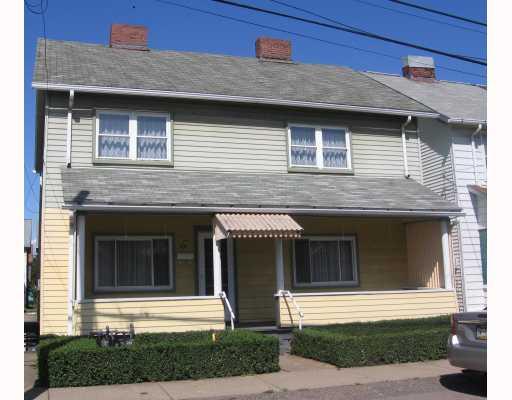 70-72 Ohio Street McKees Rocks, PA 15136 - Photo 1 of 13 Exterior Front. Lovely front porch. Possible two units.