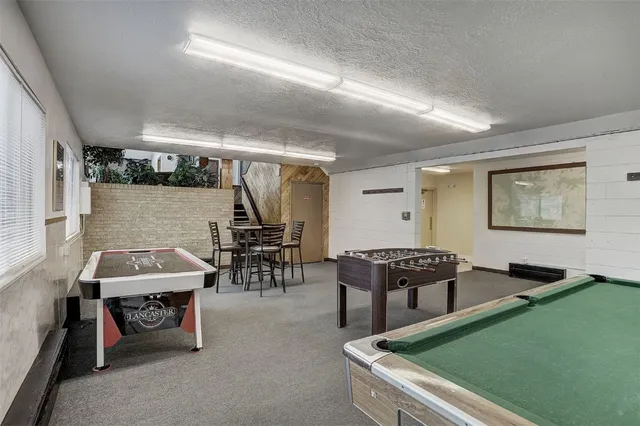 a large white kitchen with stainless steel appliances