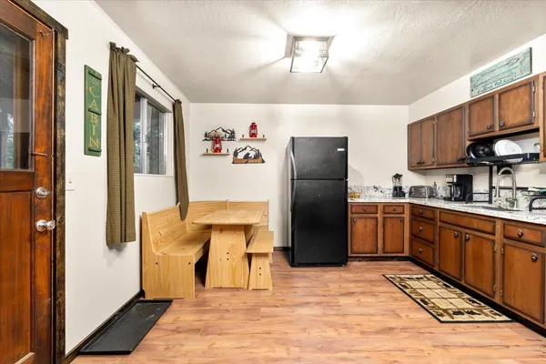 a view of a kitchen from the hallway