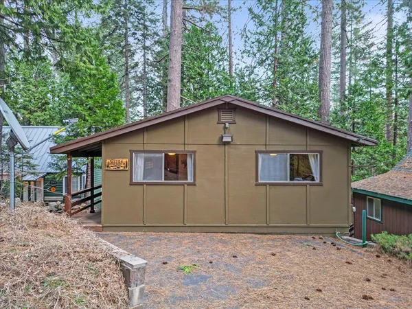 a house with trees in the background