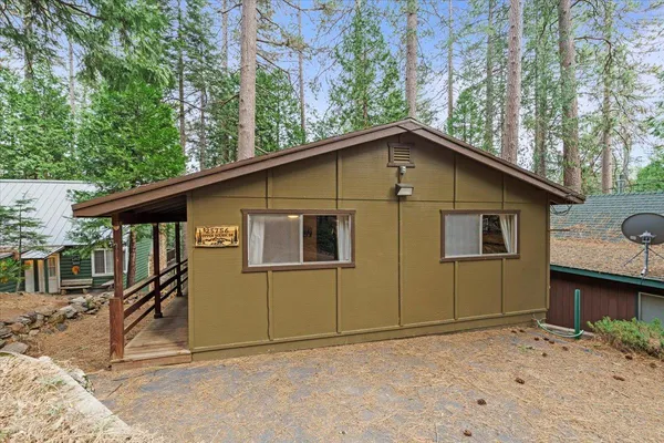 a house with trees in the background