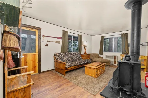 a bedroom with furniture and a large window
