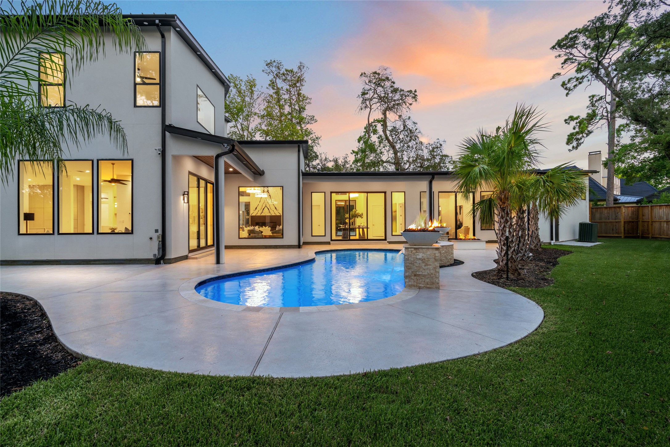 625 Piney Point Road Houston, TX 77024 - Photo 34 of 42 a view of a house with swimming pool and a yard