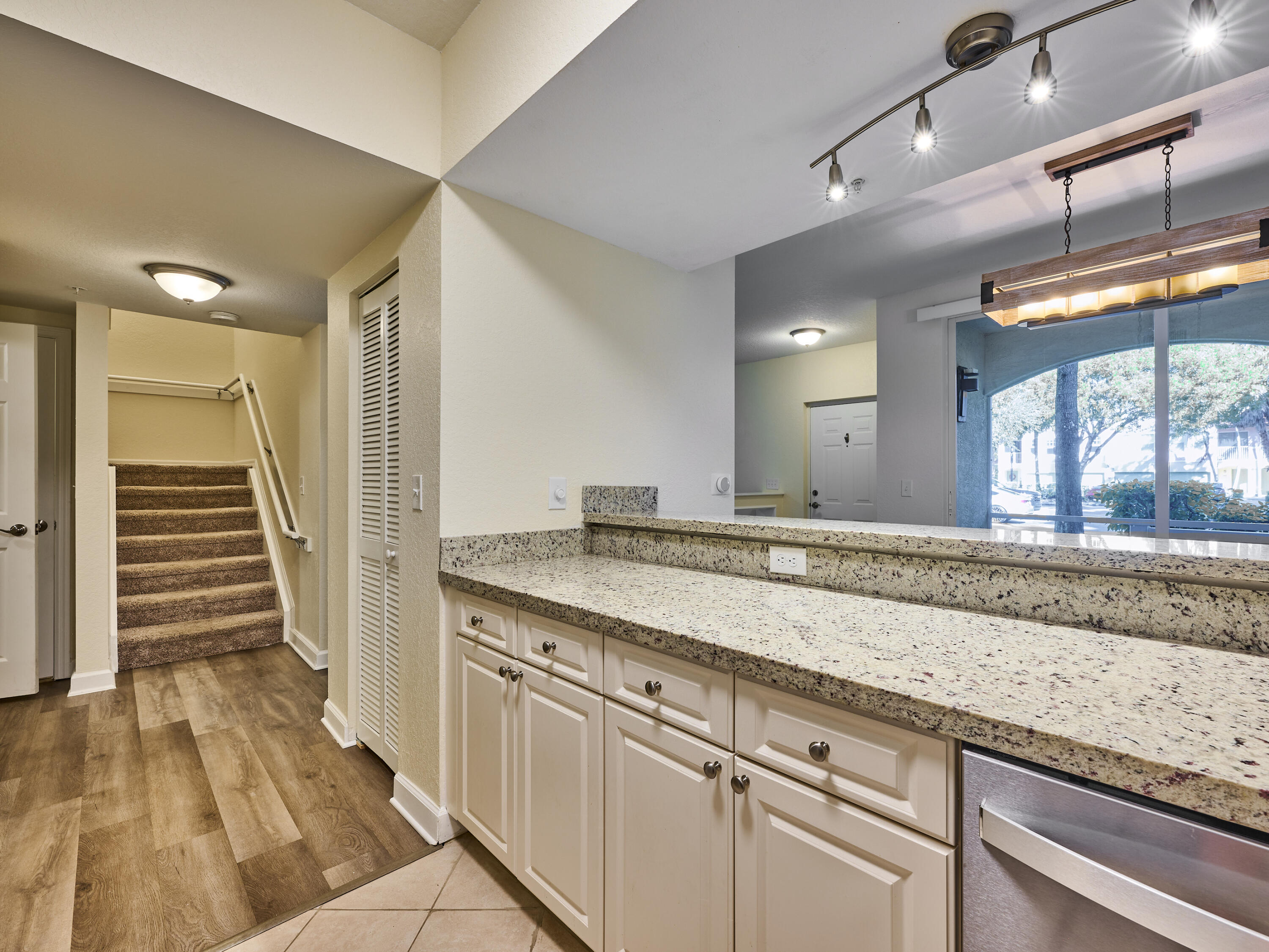 6344 West Sample Road, Unit 6344 Coral Springs, FL 33067 - Photo 11 of 30 a bathroom with a granite countertop sink and a mirror