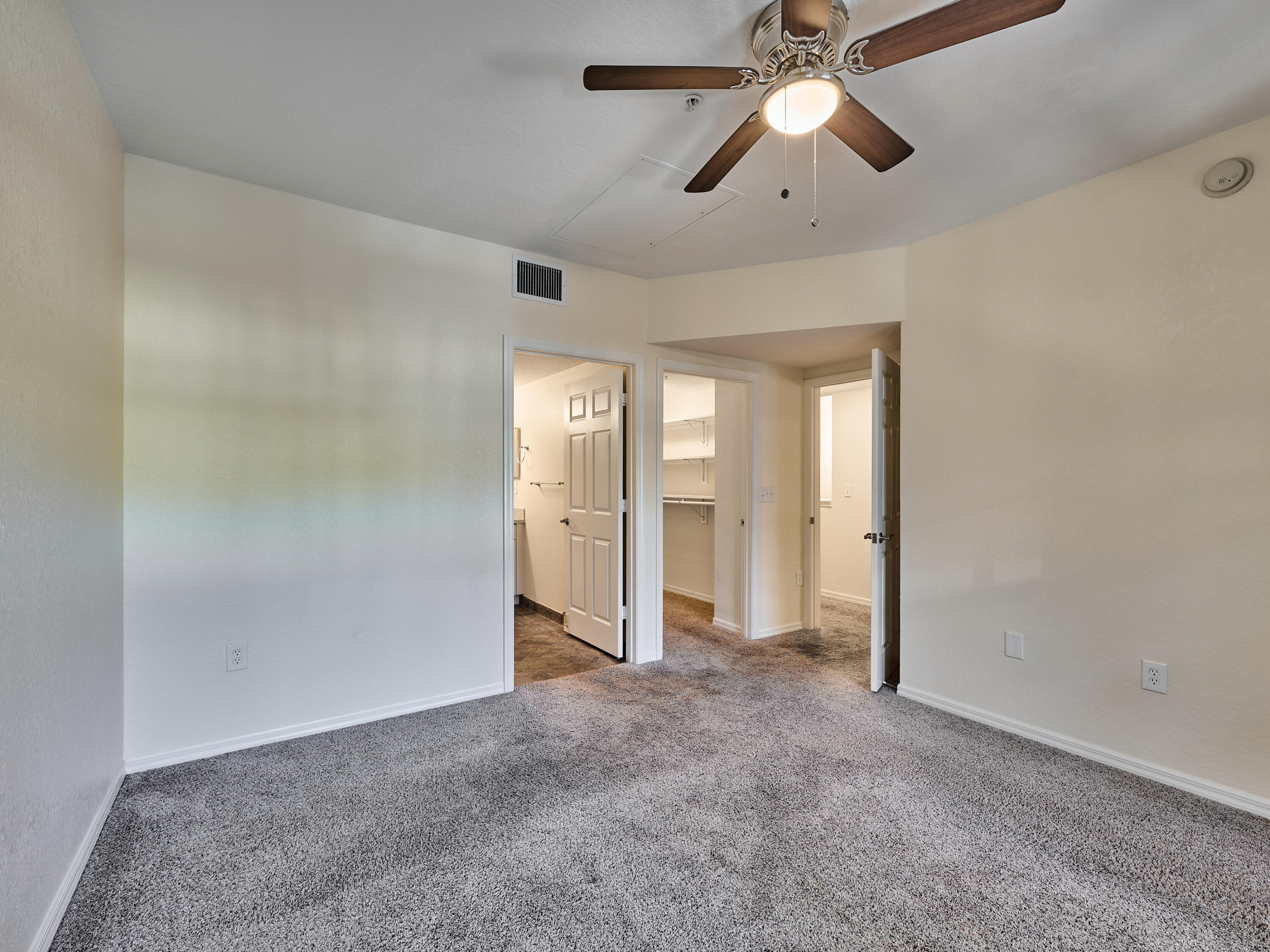 6344 West Sample Road, Unit 6344 Coral Springs, FL 33067 - Photo 18 of 30 a view of empty room with chandelier fan