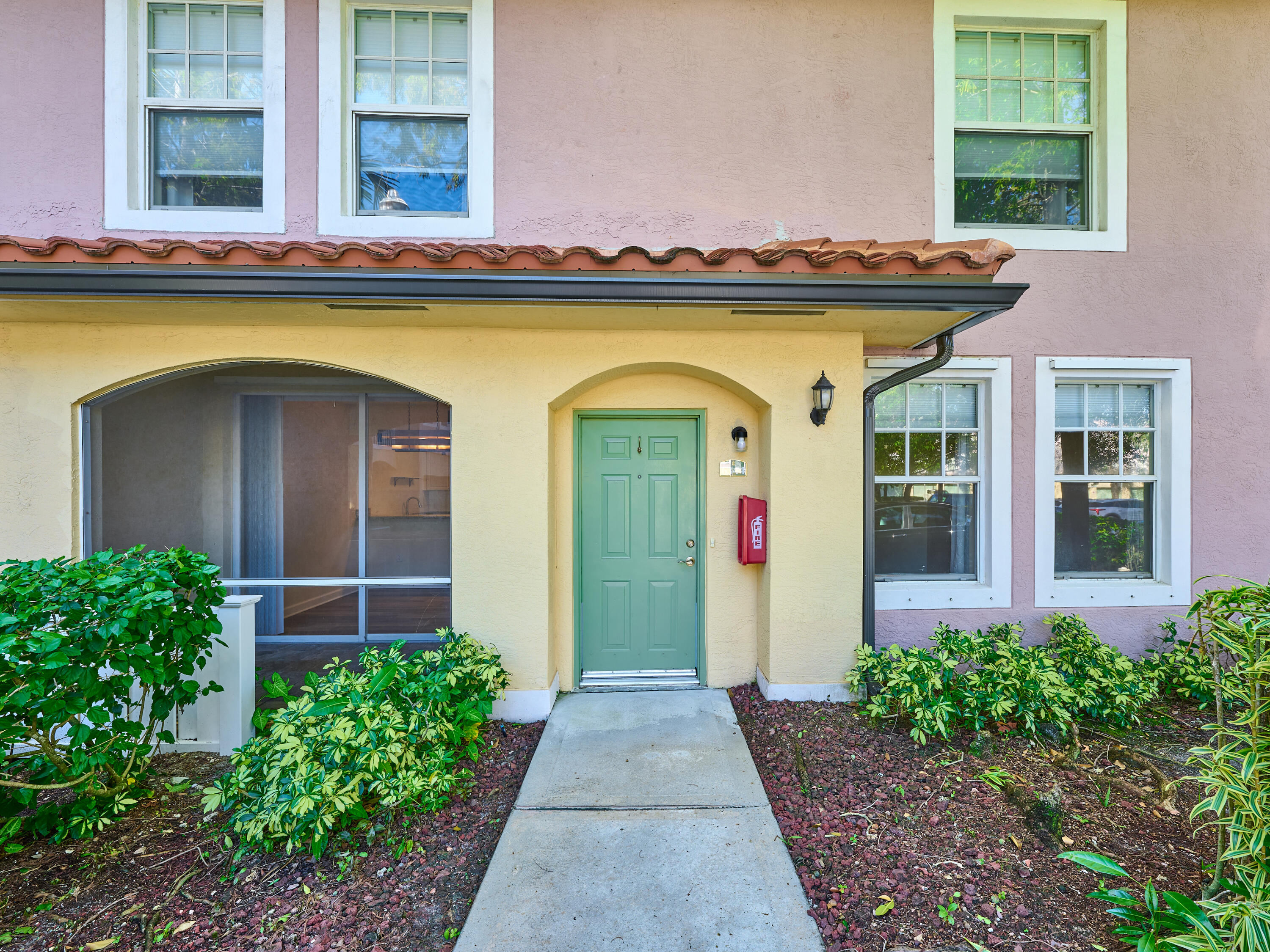 6344 West Sample Road, Unit 6344 Coral Springs, FL 33067 - Photo 2 of 30 a front view of a house with porch