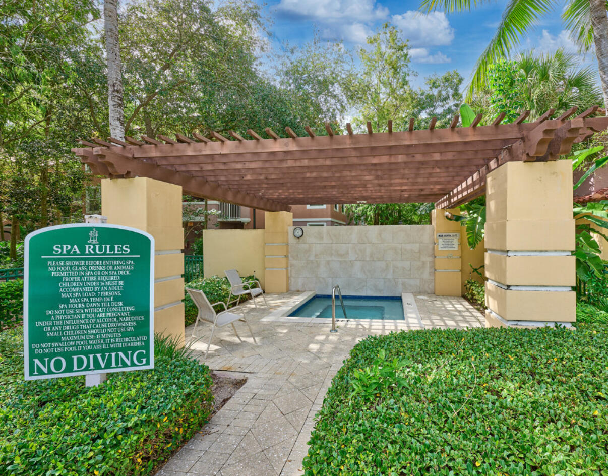 6344 West Sample Road, Unit 6344 Coral Springs, FL 33067 - Photo 27 of 30 a view of a backyard with plants