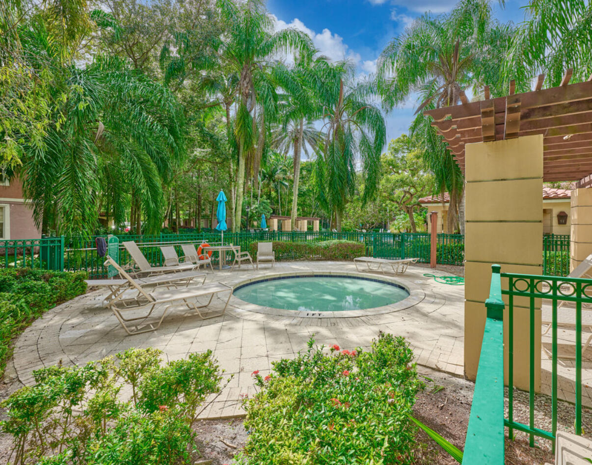 6344 West Sample Road, Unit 6344 Coral Springs, FL 33067 - Photo 28 of 30 a view of a fountain in front of a house