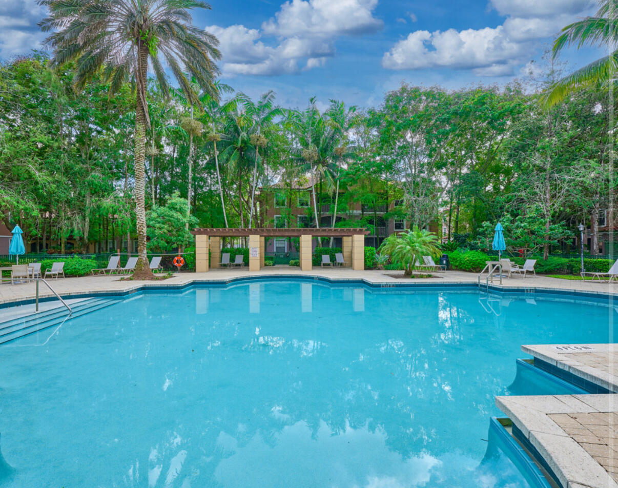 6344 West Sample Road, Unit 6344 Coral Springs, FL 33067 - Photo 29 of 30 a view of a swimming pool with a patio