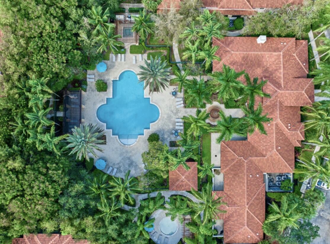 6344 West Sample Road, Unit 6344 Coral Springs, FL 33067 - Photo 30 of 30 an aerial view of a house with a yard and outdoor seating