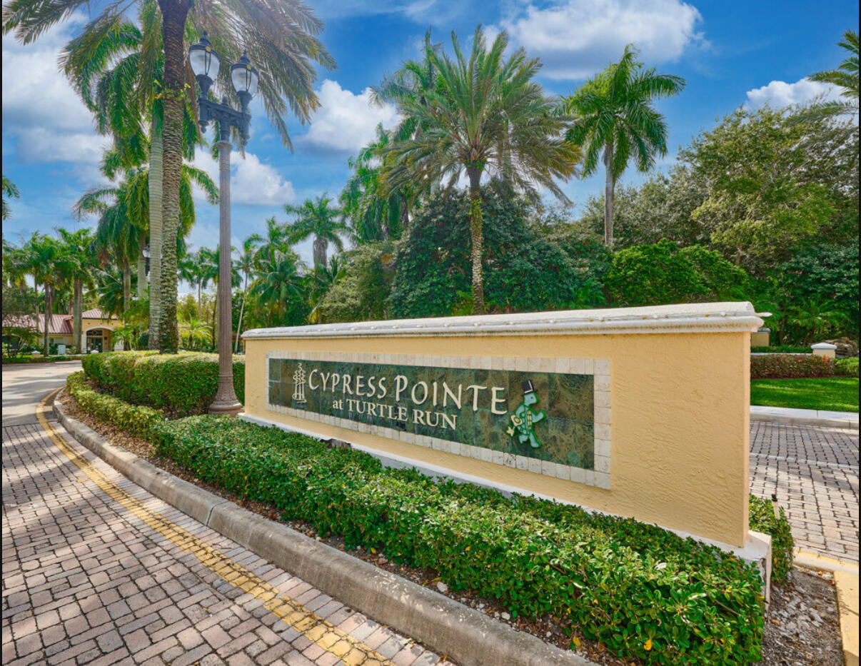 6344 West Sample Road, Unit 6344 Coral Springs, FL 33067 - Photo 3 of 30 a sign on the side of a building