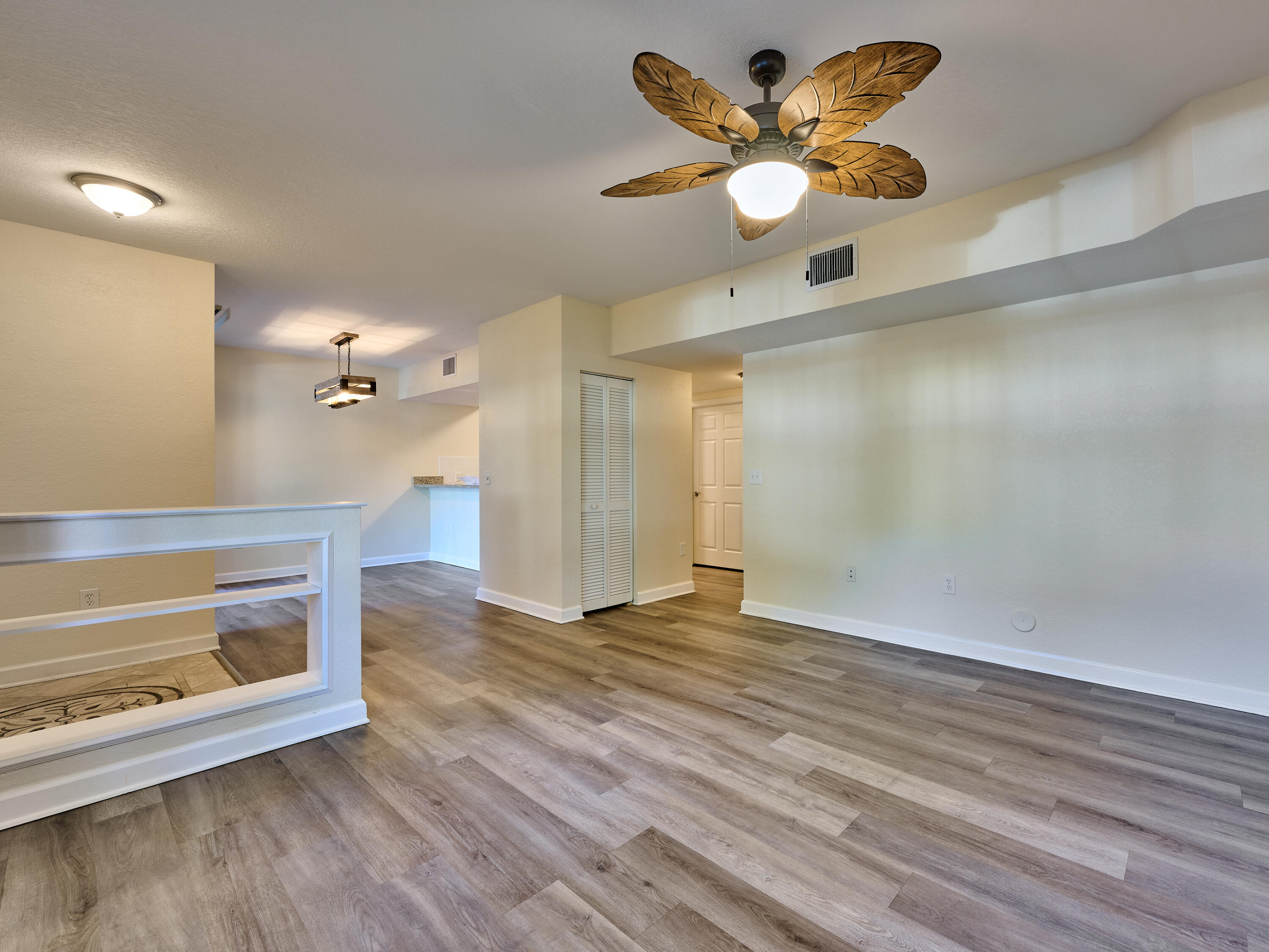 6344 West Sample Road, Unit 6344 Coral Springs, FL 33067 - Photo 6 of 30 a view of an empty room with a window and a ceiling fan