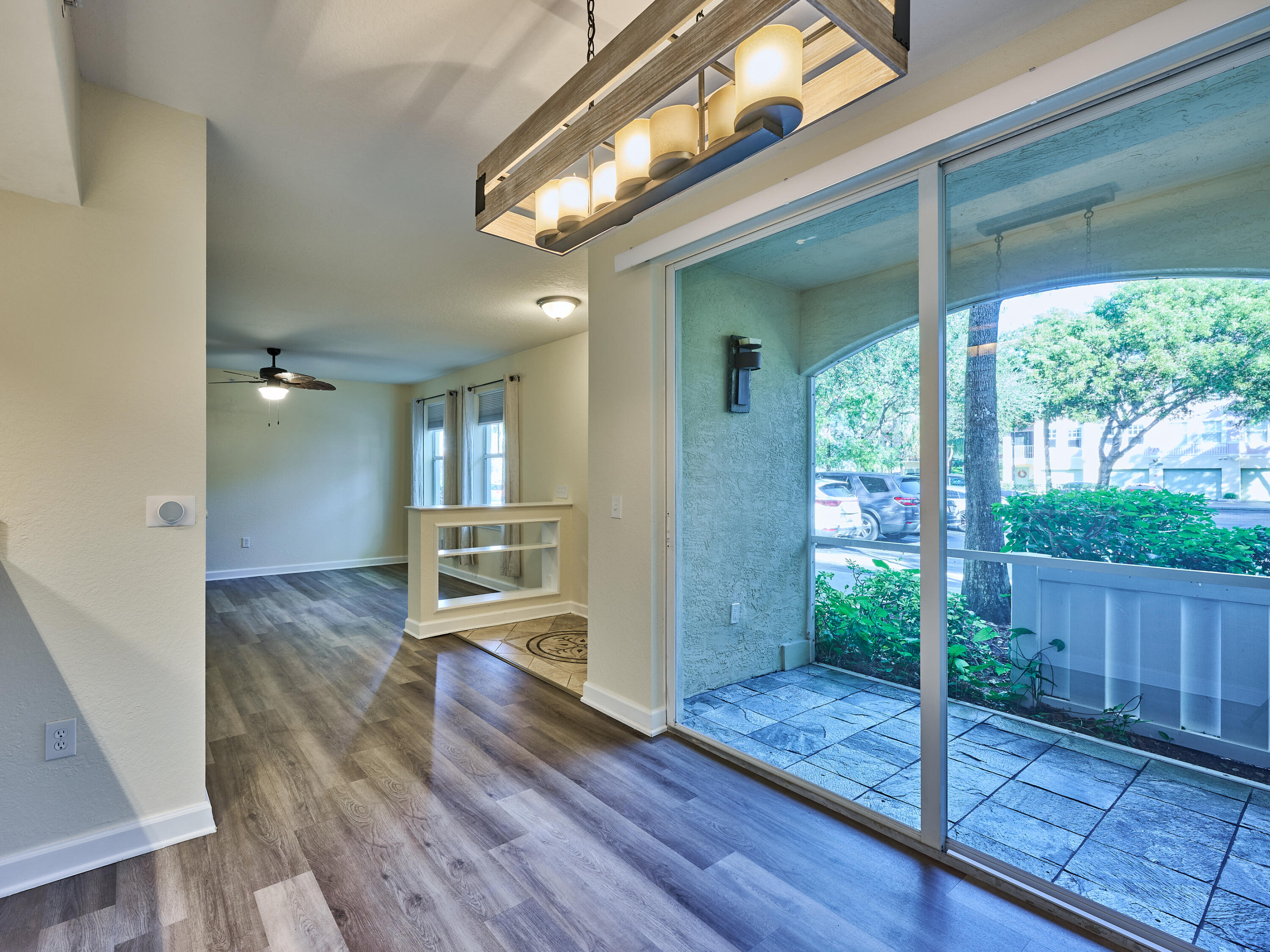 6344 West Sample Road, Unit 6344 Coral Springs, FL 33067 - Photo 8 of 30 a view of a living room and hardwood floor