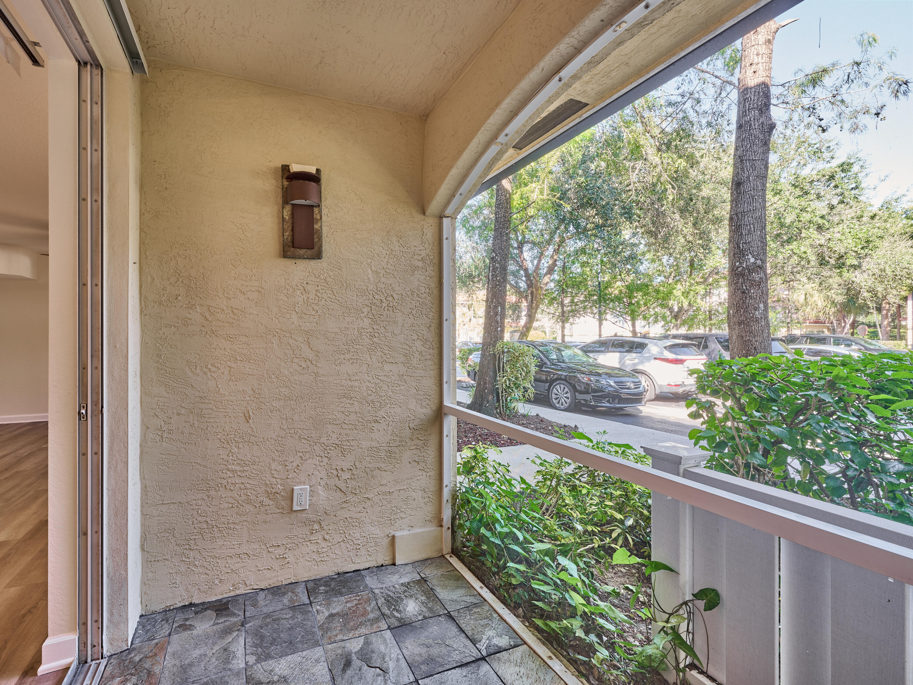 6344 West Sample Road, Unit 6344 Coral Springs, FL 33067 - Photo 9 of 30 a view of a door with a tree in front of it