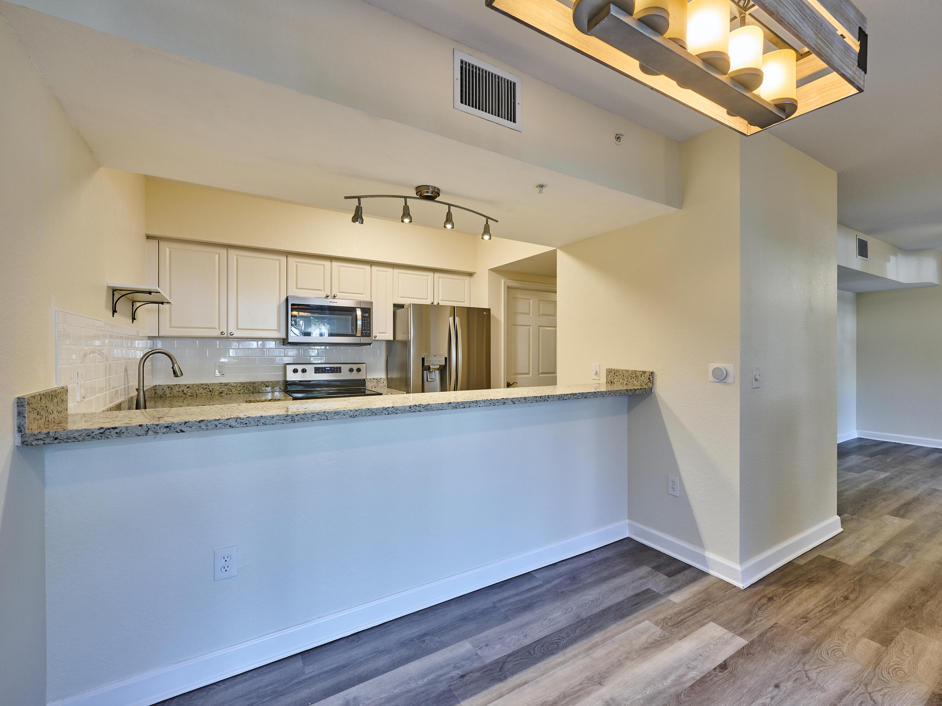 6344 West Sample Road, Unit 6344 Coral Springs, FL 33067 - Photo 10 of 30 a view of a kitchen with stainless steel appliances granite countertop a refrigerator and a sink