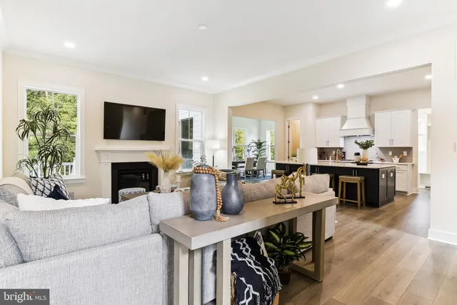 a living room with fireplace furniture and a flat screen tv