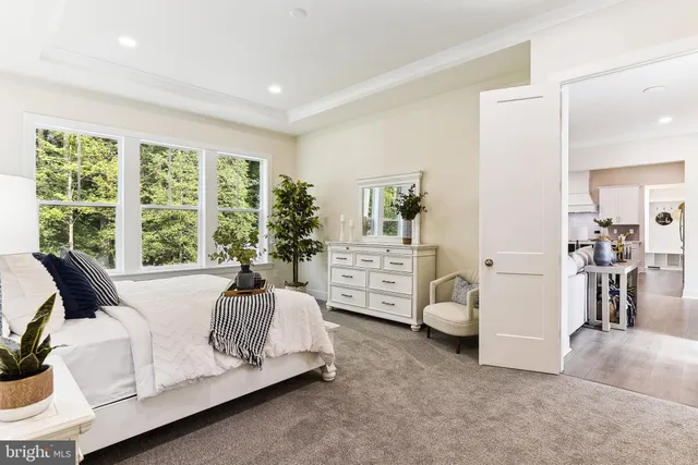 a spacious bedroom with a bed and a couch