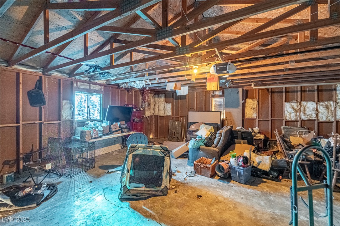4231 West Wilson Road Pahrump, NV 89048 - Photo 14 of 15 Miscellaneous room with a garage and vaulted ceiling