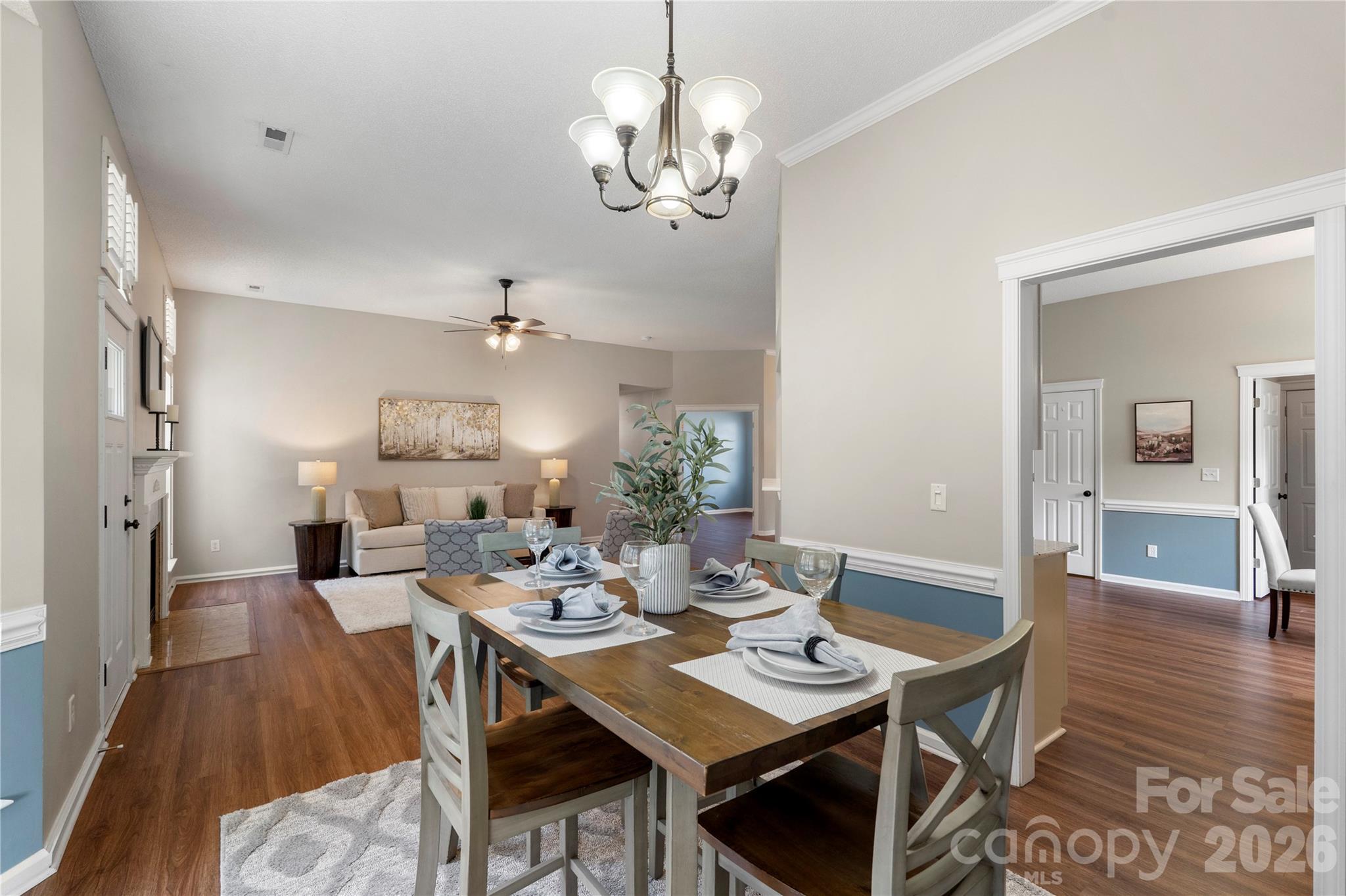 12028 Regent Ridge Lane Charlotte, NC 28278 - Photo 11 of 42 a view of a dining room with furniture wooden floor and chandelier