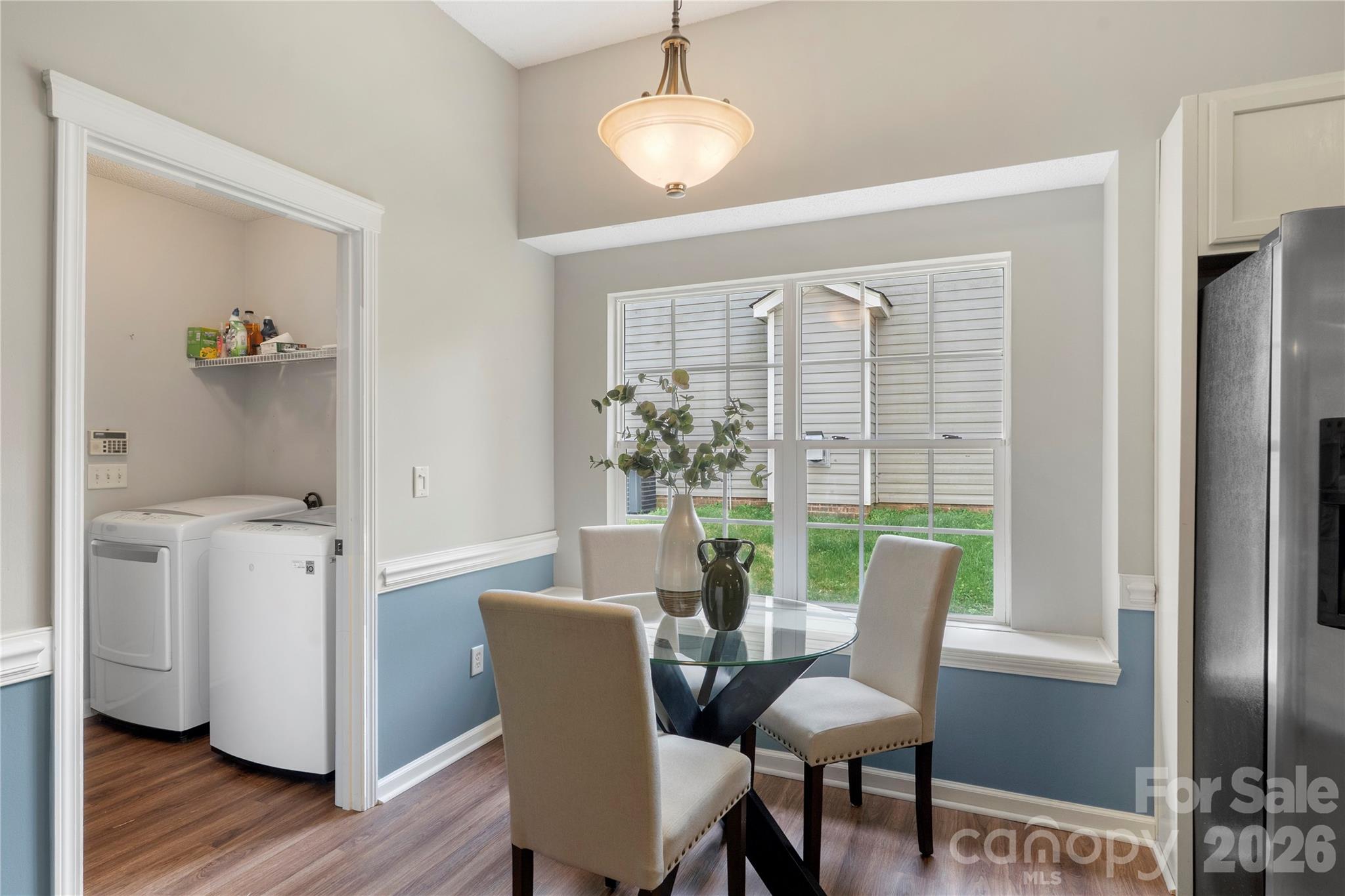 12028 Regent Ridge Lane Charlotte, NC 28278 - Photo 16 of 42 a view of a dining room with furniture window and wooden floor