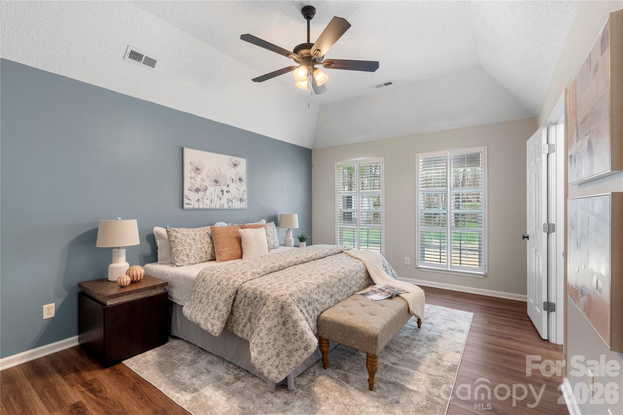 12028 Regent Ridge Lane Charlotte, NC 28278 - Photo 18 of 42 a spacious bedroom with a bed and a large window