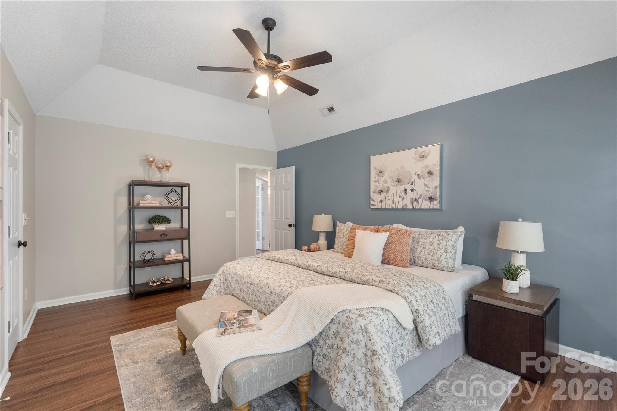 12028 Regent Ridge Lane Charlotte, NC 28278 - Photo 19 of 42 a bedroom with a bed and a couch
