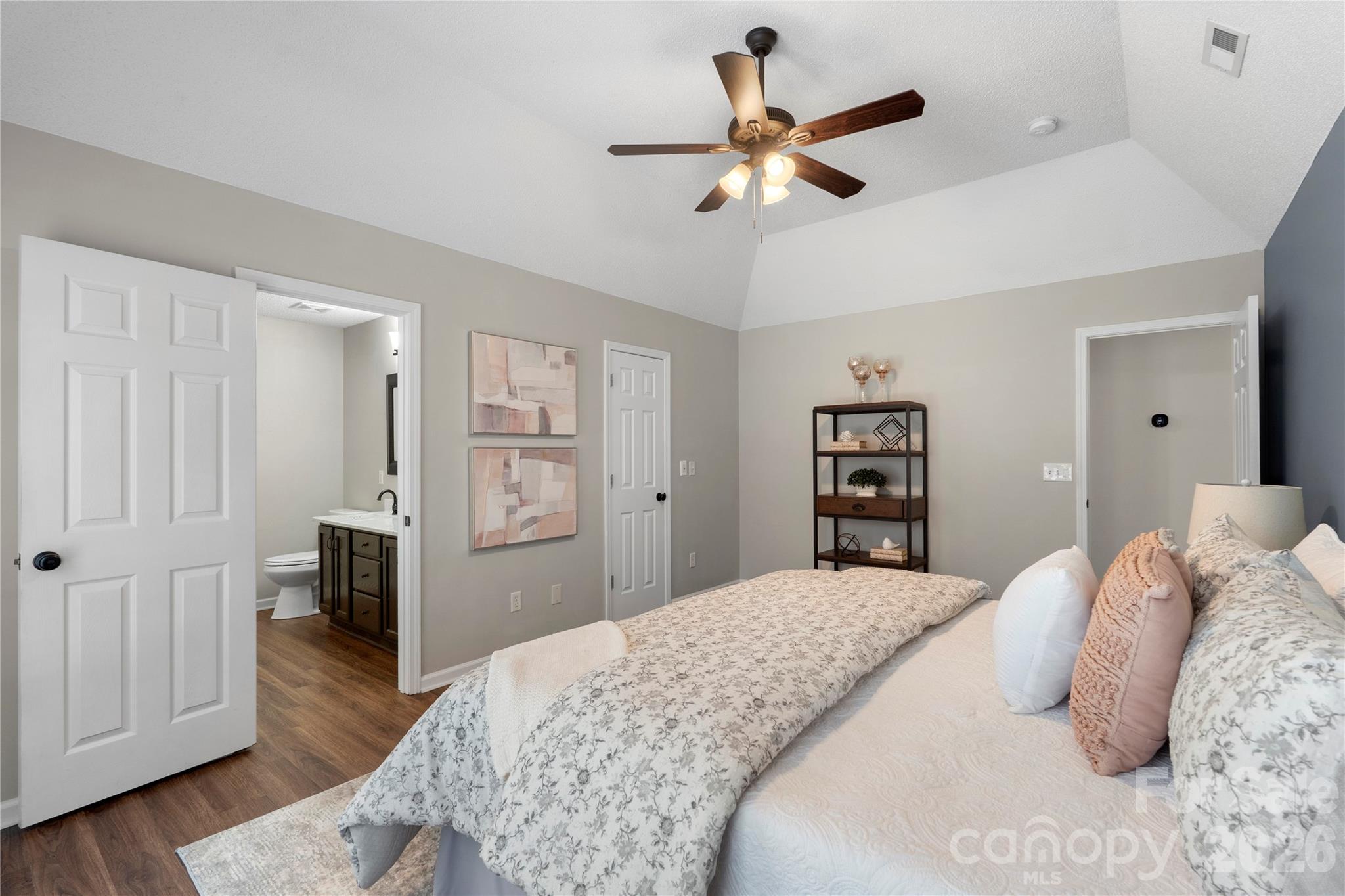 12028 Regent Ridge Lane Charlotte, NC 28278 - Photo 20 of 42 a bedroom with a large bed and a chandelier