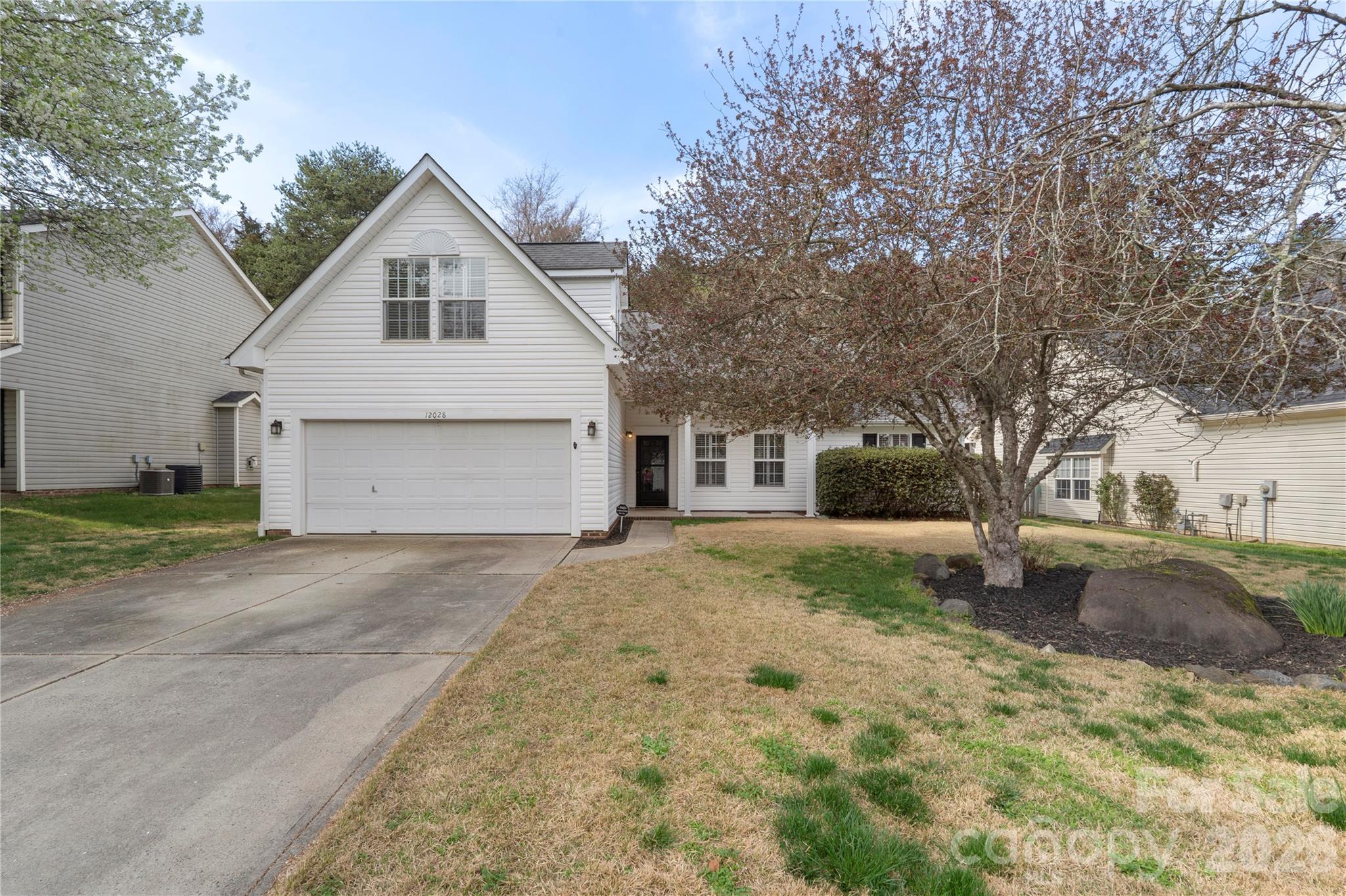 12028 Regent Ridge Lane Charlotte, NC 28278 - Photo 2 of 42 a view of a house with a yard covered in snow