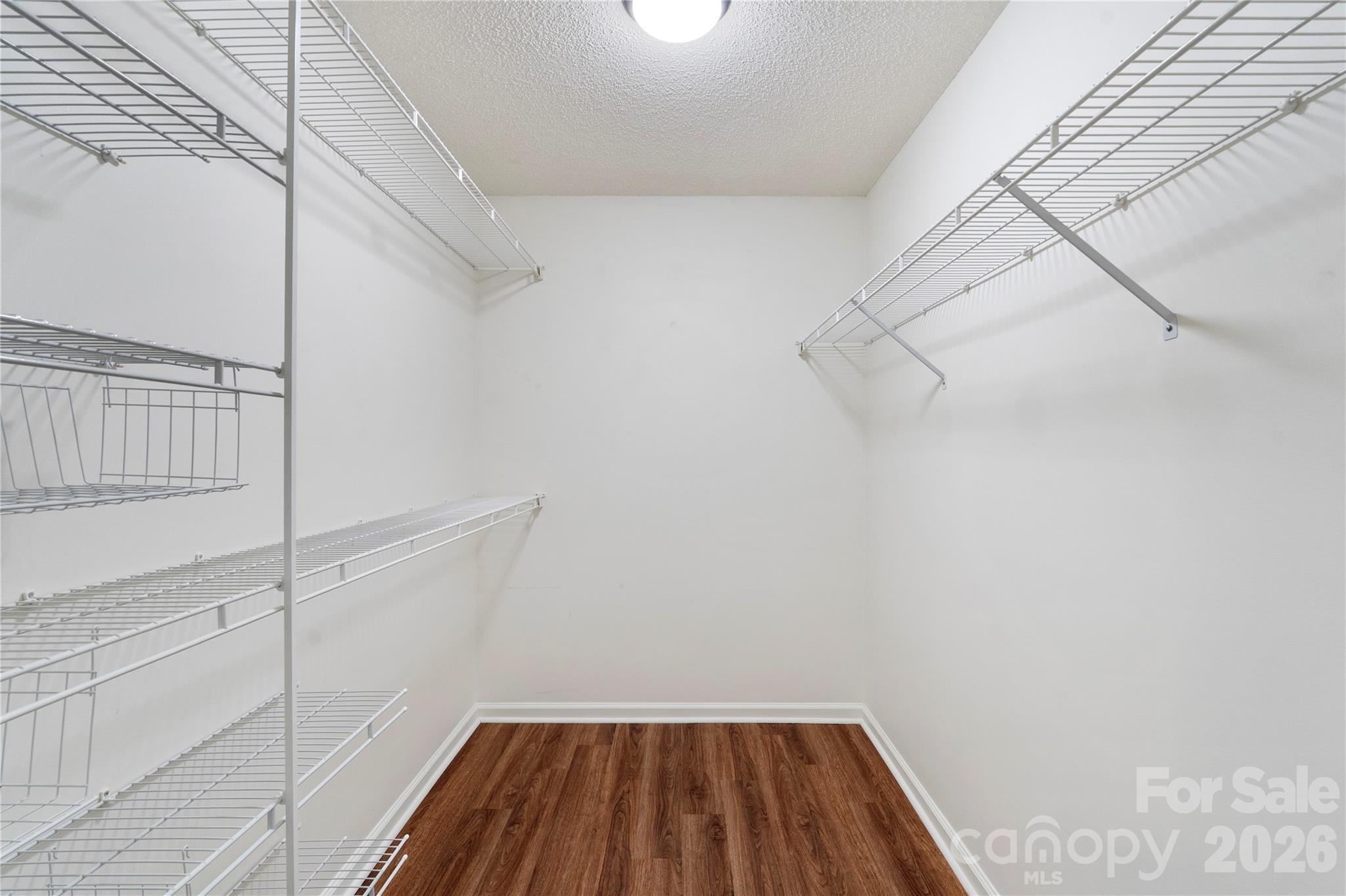 12028 Regent Ridge Lane Charlotte, NC 28278 - Photo 24 of 42 a view of a room with racks on the wall