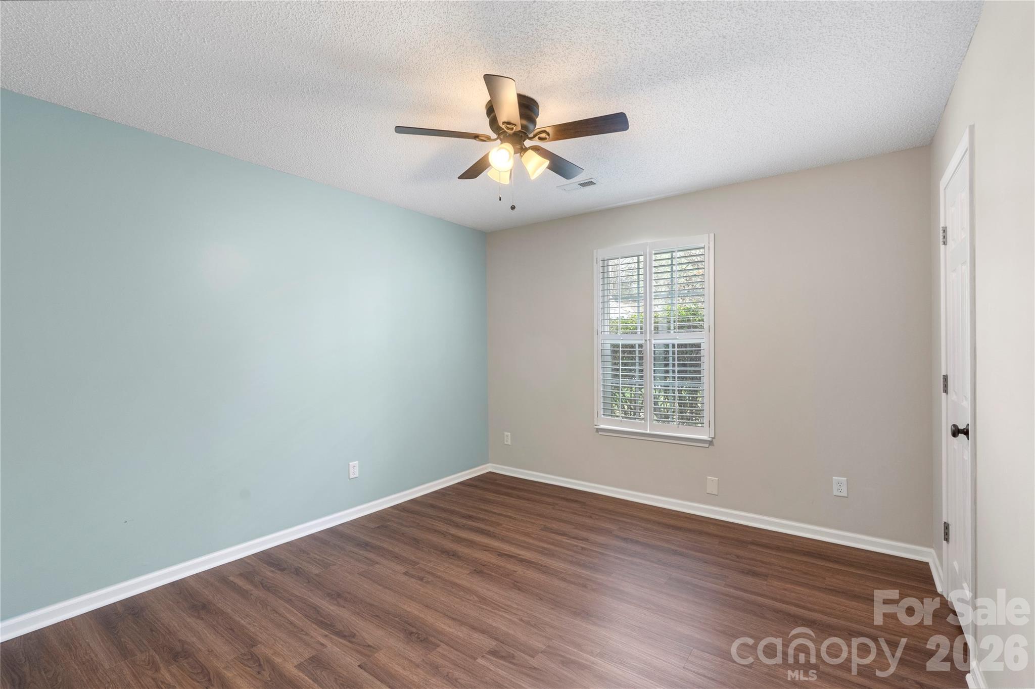 12028 Regent Ridge Lane Charlotte, NC 28278 - Photo 25 of 42 wooden floor in an empty room with a window