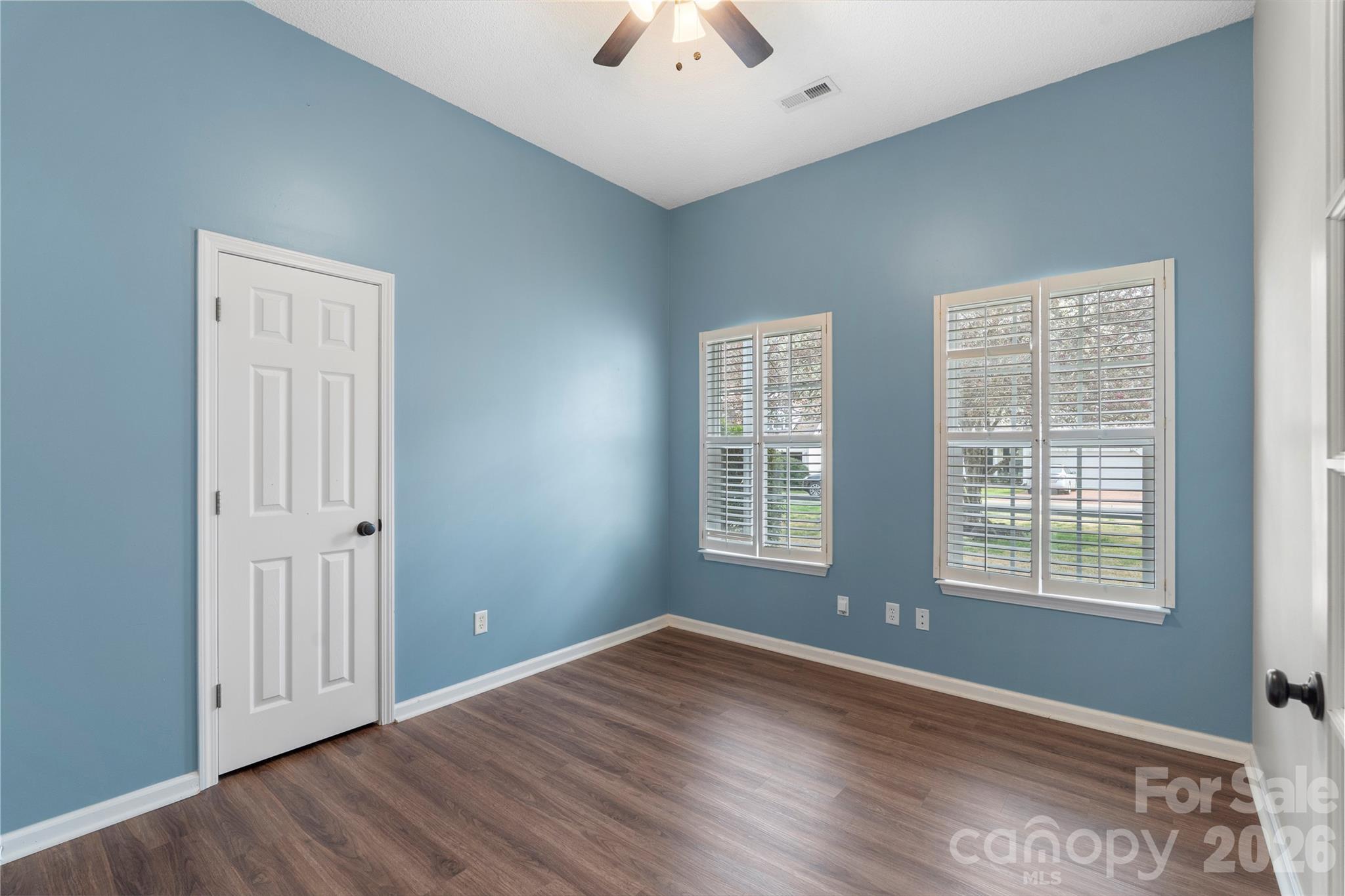 12028 Regent Ridge Lane Charlotte, NC 28278 - Photo 28 of 42 a view of an empty room with wooden floor and a window