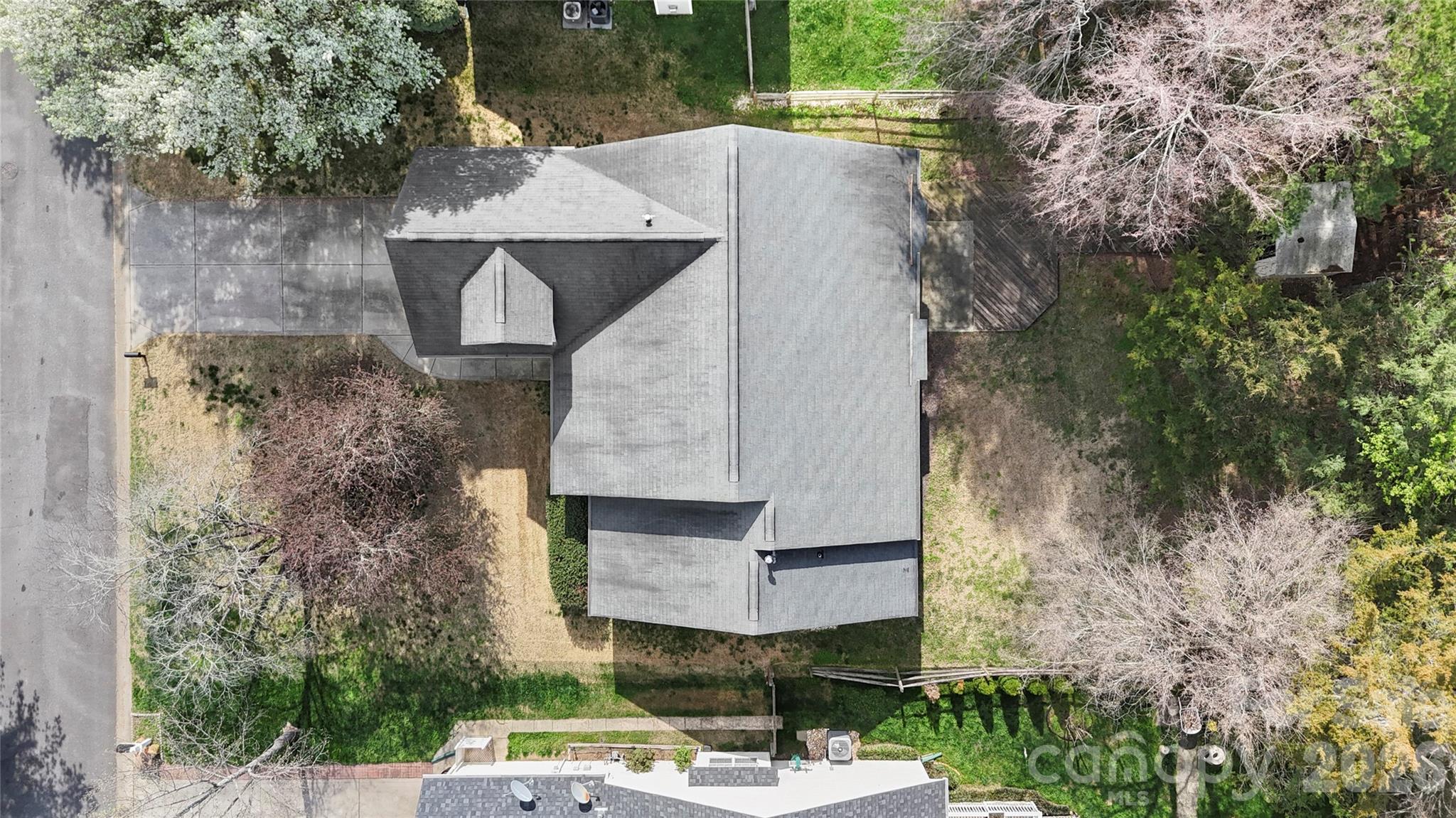 12028 Regent Ridge Lane Charlotte, NC 28278 - Photo 40 of 42 an aerial view of a house with a yard and large trees