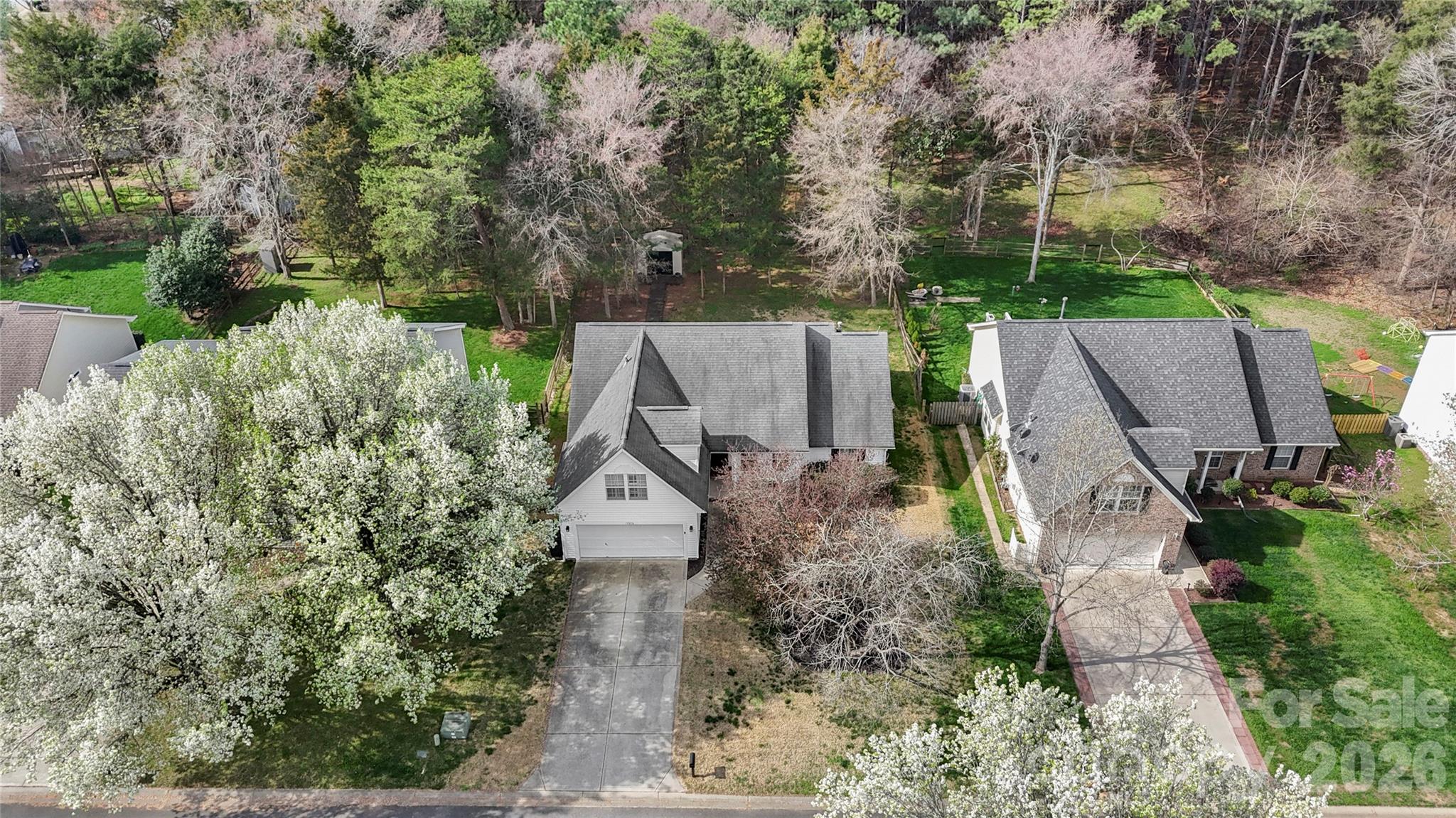 12028 Regent Ridge Lane Charlotte, NC 28278 - Photo 41 of 42 an aerial view of a house with outdoor space and trees all around